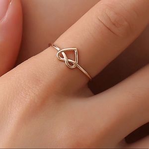3/$30
Gold Tone Heart Knot Ring
